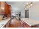 Bright, open kitchen with stainless steel appliances and a view into an adjacent seating area at 4683 W Lawrence Way, New Palestine, IN 46163