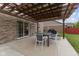 Outdoor patio features a pergola with a dining table set, perfect for outdoor gatherings at 4683 W Lawrence Way, New Palestine, IN 46163