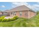 Brick home featuring well manicured lawn and landscaping with a cozy patio at 4725 W Harrisburg Ct, New Palestine, IN 46163