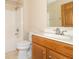 Bathroom featuring a shower-tub combo, toilet, and vanity with a single sink at 4725 W Harrisburg Ct, New Palestine, IN 46163
