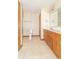 Bathroom with tiled floors, a shower with a glass door, and a vanity at 4725 W Harrisburg Ct, New Palestine, IN 46163