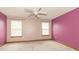 Spacious bedroom with two large windows and a ceiling fan at 4725 W Harrisburg Ct, New Palestine, IN 46163