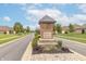 Centennial Commons neighborhood entrance with brick sign and manicured landscaping at 4725 W Harrisburg Ct, New Palestine, IN 46163