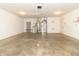 Clean two car garage with sealed concrete floors, utility access, and bright lighting at 4725 W Harrisburg Ct, New Palestine, IN 46163