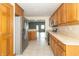 Bright kitchen with ample cabinet space, stainless steel appliances, and an open layout at 4725 W Harrisburg Ct, New Palestine, IN 46163