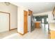 Kitchen has stainless steel refrigerator and leads to other rooms in the home at 4725 W Harrisburg Ct, New Palestine, IN 46163