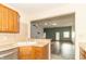 Open kitchen with an inviting view into an adjacent living area, creating a spacious and connected living space at 4725 W Harrisburg Ct, New Palestine, IN 46163