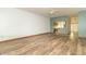 Open floor plan living room with hard surface flooring and views to other rooms at 4725 W Harrisburg Ct, New Palestine, IN 46163