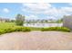 Paver stone patio overlooks manicured lawn, community pond and lush neighborhood at 4725 W Harrisburg Ct, New Palestine, IN 46163
