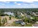Serene aerial view showcasing a beautiful home near a tranquil lake and lush landscaping at 4808 Lakeview Dr, Greenwood, IN 46143