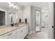 Bathroom featuring a modern vanity with marble countertop and a walk-in shower at 4808 Lakeview Dr, Greenwood, IN 46143