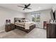 Bedroom with a large window, a ceiling fan, and neutral décor with a checkered comforter at 4808 Lakeview Dr, Greenwood, IN 46143
