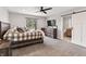 Bedroom with a ceiling fan, a window, and a view of an ensuite bathroom at 4808 Lakeview Dr, Greenwood, IN 46143
