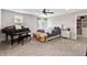 Cozy bedroom featuring plush carpet, a piano, and a comfortable bed with stylish bedding at 4808 Lakeview Dr, Greenwood, IN 46143