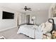 Bright bedroom with a bed, television, and mirror at 4808 Lakeview Dr, Greenwood, IN 46143