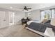 Inviting bedroom boasts soft carpet, natural light, and a comfortable bed, near the bathroom at 4808 Lakeview Dr, Greenwood, IN 46143