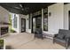 Inviting covered patio with a brick fireplace and comfortable seating arrangement at 4808 Lakeview Dr, Greenwood, IN 46143