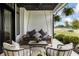 Inviting covered porch with a relaxing swing, stylish chairs, and decorative plants at 4808 Lakeview Dr, Greenwood, IN 46143