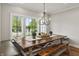 Dining area features a wooden table, bench seating, and large windows with a view at 4808 Lakeview Dr, Greenwood, IN 46143