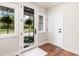 Entryway featuring a glass door, sidelight window, and a neutral color scheme at 4808 Lakeview Dr, Greenwood, IN 46143