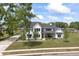 Beautifully landscaped front lawn of a modern farmhouse with mature trees and impeccable design at 4808 Lakeview Dr, Greenwood, IN 46143