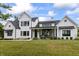 Stunning two-story white home with black trim and a meticulously landscaped front yard at 4808 Lakeview Dr, Greenwood, IN 46143