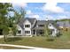 Elegant two-story home with a landscaped front yard and a covered porch for outdoor relaxation at 4808 Lakeview Dr, Greenwood, IN 46143