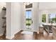 Bright foyer with wood floors, stylish shelving, and a view of the outdoors at 4808 Lakeview Dr, Greenwood, IN 46143