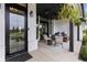 Welcoming front porch with a swing, comfortable seating, and decorative hanging plants at 4808 Lakeview Dr, Greenwood, IN 46143