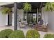 Charming front porch with a swing, stylish seating, and well-maintained landscaping at 4808 Lakeview Dr, Greenwood, IN 46143