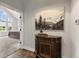 Hallway leading to bedroom with a sideboard adorned with a mountain painting at 4808 Lakeview Dr, Greenwood, IN 46143