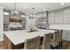 Bright kitchen with oversized island, white countertop, stainless appliances, and gray cabinetry at 4808 Lakeview Dr, Greenwood, IN 46143