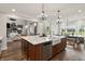 Spacious kitchen with island, farmhouse sink, stainless steel appliances, and open floor plan at 4808 Lakeview Dr, Greenwood, IN 46143
