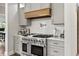 Modern kitchen with stainless steel range, custom cabinets, and stylish backsplash at 4808 Lakeview Dr, Greenwood, IN 46143