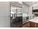 Modern kitchen featuring stainless steel refrigerator and sleek gray cabinetry at 4808 Lakeview Dr, Greenwood, IN 46143