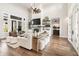 Bright living room featuring a stone fireplace, floating shelves, and soaring ceilings at 4808 Lakeview Dr, Greenwood, IN 46143
