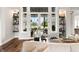 Living room featuring a glass patio door with transom windows and floating shelves at 4808 Lakeview Dr, Greenwood, IN 46143