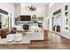Spacious living room boasts natural light, a stone fireplace, and stylish decor at 4808 Lakeview Dr, Greenwood, IN 46143
