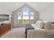 Bright main bedroom boasts vaulted ceilings and a large window with a view of the backyard at 4808 Lakeview Dr, Greenwood, IN 46143