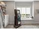 Walk-in closet with mirror and shelves near a window that provides natural light at 4808 Lakeview Dr, Greenwood, IN 46143