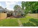Inviting backyard with a wooden deck and patio furniture, perfect for outdoor relaxation at 4818 Winthrop Ave, Indianapolis, IN 46205