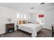 Cozy bedroom featuring a queen bed with white bedding and a window seat at 4818 Winthrop Ave, Indianapolis, IN 46205