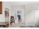 Hallway with views of a laundry room and small wooden shelf at 4818 Winthrop Ave, Indianapolis, IN 46205