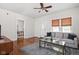 Cozy living room with hardwood floors, a comfortable sofa, and a view into another room at 4818 Winthrop Ave, Indianapolis, IN 46205