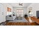 Bright living room featuring hardwood floors, a comfortable sofa, and stylish decor at 4818 Winthrop Ave, Indianapolis, IN 46205