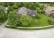 Aerial view of a home with mature trees and a green lawn at 4949 Jennings Dr, Carmel, IN 46033