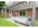 Outdoor patio featuring a wooden pergola, seating, and a BBQ grill at 4949 Jennings Dr, Carmel, IN 46033