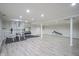 Spacious basement gym with weight rack and bench for a complete fitness experience at 4949 Jennings Dr, Carmel, IN 46033