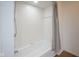 Well-lit bathroom with a shower/tub combo and tile surround at 4949 Jennings Dr, Carmel, IN 46033