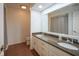 Bathroom vanity featuring double sinks, granite countertops and ample storage at 4949 Jennings Dr, Carmel, IN 46033